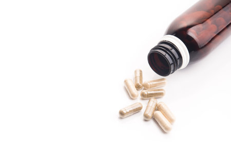 Medical herbal capsules isolated on a white background. alternative treatment.