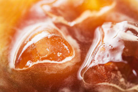 closeup of cold summer caramel cocktail with ice on a cafe tableの写真素材