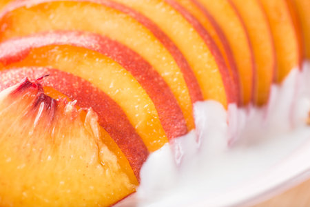 closeup of peach slices and yogurt background