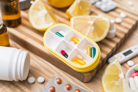 Yellow capsule container box with pills for daily take medicine. treatment of influenza flu virus.