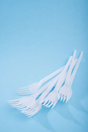 Creative concept of reducing the use of plastic tableware on a pastel color background.の写真素材