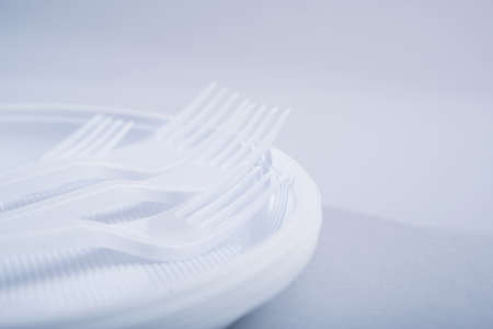 Creative concept of reducing the use of plastic tableware on a pastel color background.の写真素材