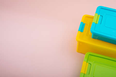 Plastic container box on a pastel color backgroundの写真素材