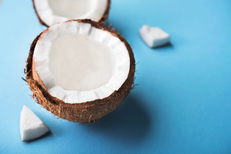 Fresh coconut fruit on a blue