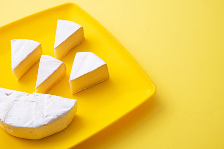 France cheese camembert on a yellow background