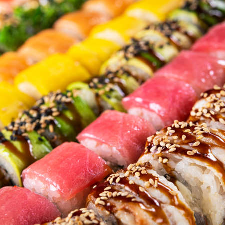 Closeup of sushi rolls on a background. Japan food. Pattern. Top view.の写真素材
