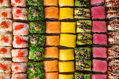 Closeup of sushi rolls on a background. Japan food. Pattern. Top view.の写真素材