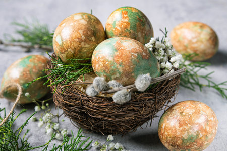 Marble color decoration Easter eggs with flowers in nest.