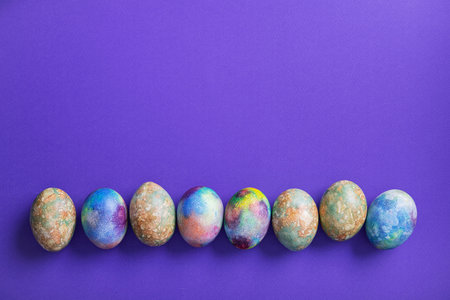 Easter eggs on a trend violet color background. top view. minimal concept. flat lay. copyspace for...