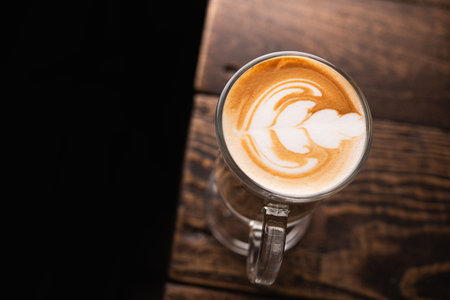White cup of coffee on a cafe table. top viewの写真素材