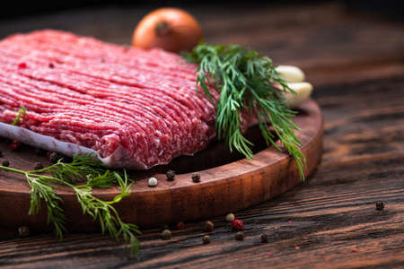Fresh minced meat with spices on a backgroundの写真素材