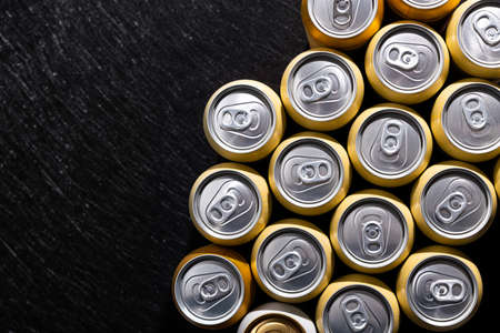 Many cans of beer on a background. top view.の写真素材