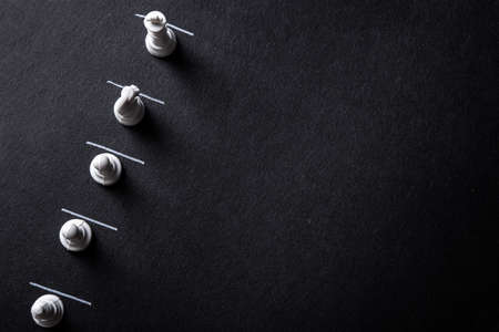 Chess pieces on a dark  with constraint lines.の写真素材