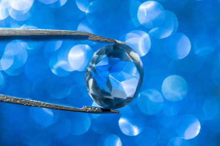 Closeup of blue diamond stone. Abstract bokeh background.の写真素材