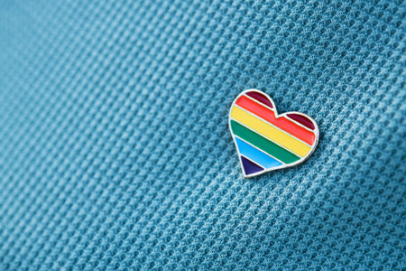 Heart shaped icon, color LGBT community pinned on clothes. support for a free parade.
