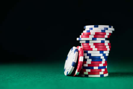 Stack chips poker on a table background. casino gambling concept.の写真素材