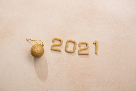 Golden 2021 number with happy new year on stone background. Top view.の写真素材