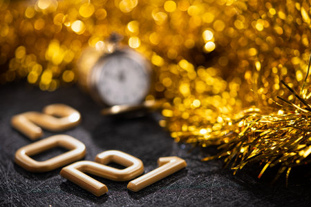 Golden 2021 number on a black background. Happy New Year celebrate banner.の写真素材