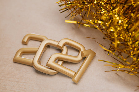 Golden 2021 number with happy new year on stone background.の写真素材
