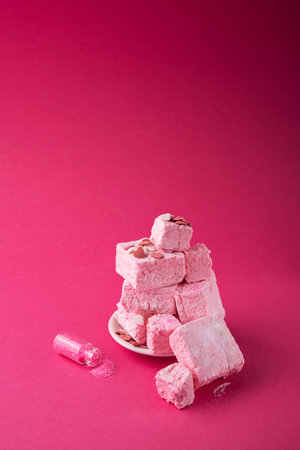 Turkish Delight on a pink background. Sweet candy food.の写真素材