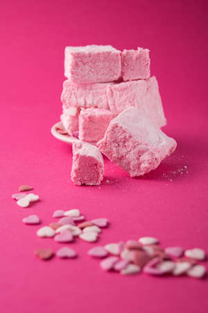 Turkish Delight on a pink background. Sweet heart candy food.の写真素材