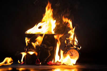 Black friday fire clock concept. time for big discounts. danger background. hot present.の写真素材