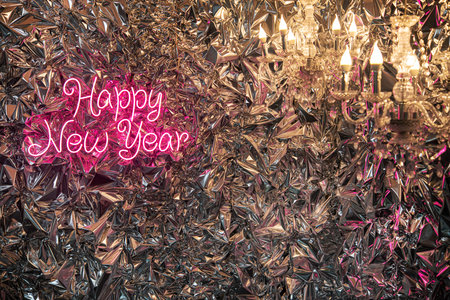 Neon Light Happy New Year sign on bright mirror specular background.の写真素材