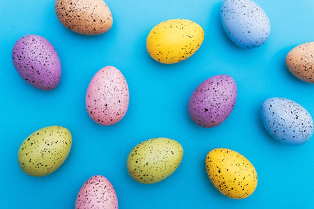 Colored easter eggs on a blue background.