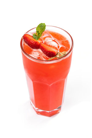 Summer drink strawberry lemonade with green mint isolated on a white background.の写真素材