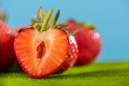 Fresh summer natural strawberry on a green grass. Food fruit background.の写真素材