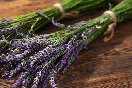 A bouquet of fresh lavender flowers on a wooden table. summer background flora.の写真素材