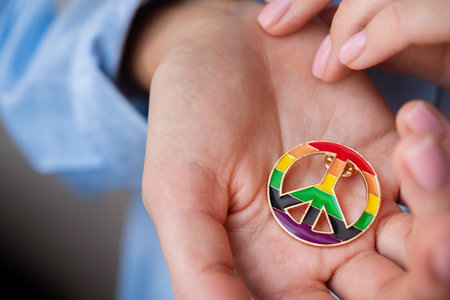 Woman with peace symbol and lgbt colors. Love, freedom concept background.の写真素材
