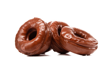 Tasty glaze chocolate donuts isolated on a white background.の写真素材