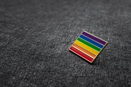 One badge lgbt society on a dark background. closeup. macro. tolerance concept. minimal.の写真素材