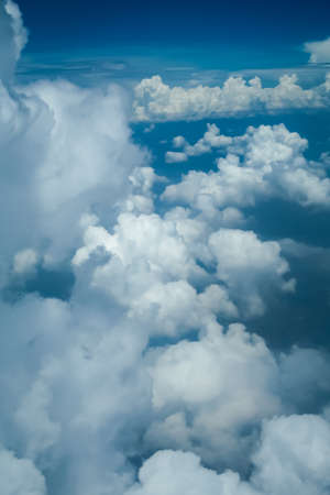 Cumulus white clouds floating on a blue skyの写真素材