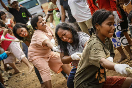 West Jakarta / Indonesia - August 30, 2008: Female playing tug of war as tradition and culture during independence day of Indonesiaのeditorial素材