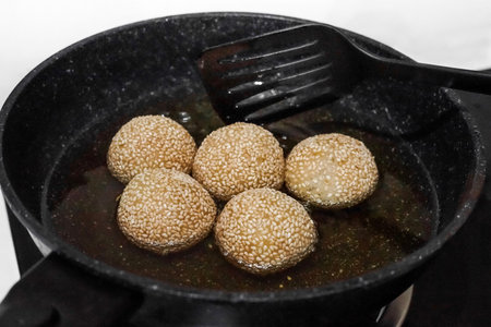 Traditional cake from Indonesia fried in hot boiling oil and made by sticky rice and sesame