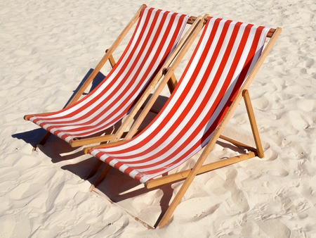 deck chairs on the beachの写真素材