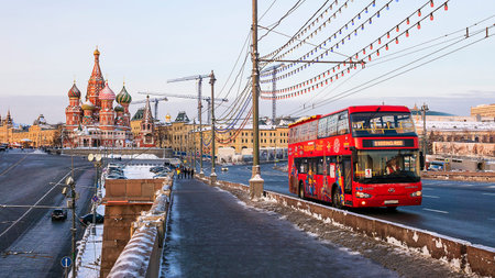 MOSCOW, RUSSIA-JANUARY 25: red tour bus City Sihgtseeng moves to the Big Moskvoretsky Bridge January...