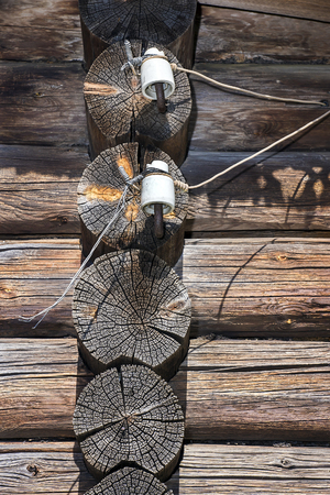 retro elements of wiring on the old wooden houseの写真素材