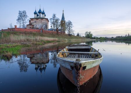 boat on the river against the background of the Orthodox Churchの写真素材
