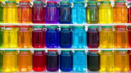 glass jar with colored liquidの写真素材
