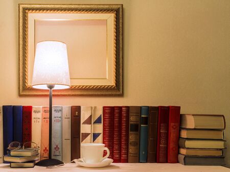 old books and a cup of coffee の写真素材