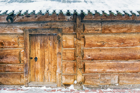old Russian wooden house snowの写真素材