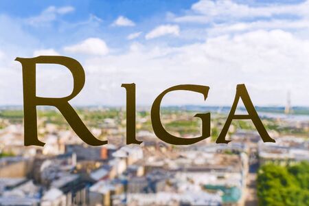 Inscription on the window: Riga. Against the backdrop of the city panoramaの写真素材
