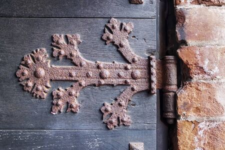 rusty hinge of an old wooden doorの写真素材