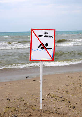 no swimming sign on the background of the seaの写真素材