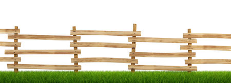wooden fence in the green grass. の写真素材