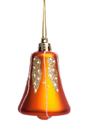 Christmas toy - a bell on a white backgroundの写真素材