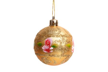 Round Christmas toy yellow and golden brown on a white backgroundの写真素材